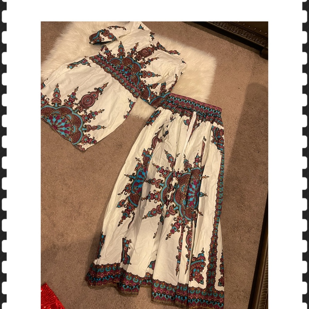 African Attire Small dress and a open skirt piece . You can wear together